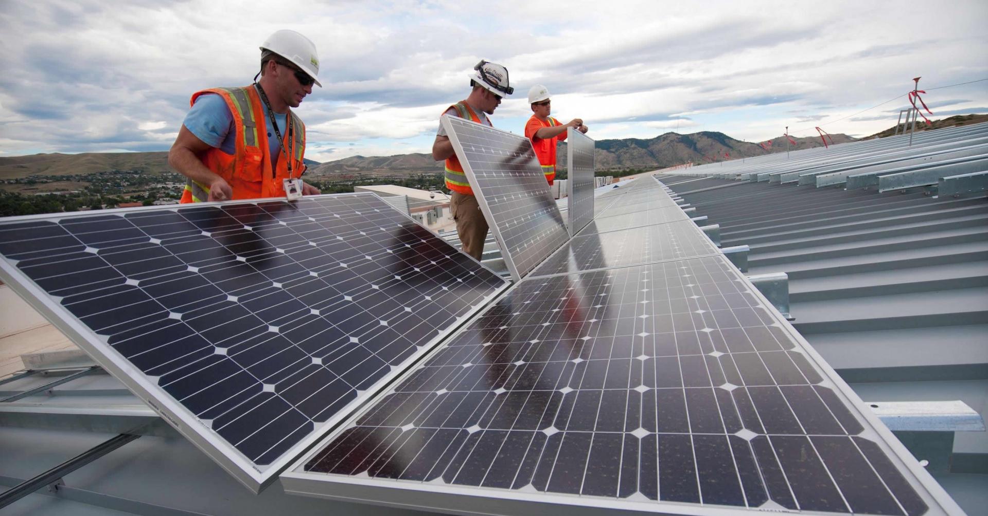 Solar workers installing solar panels