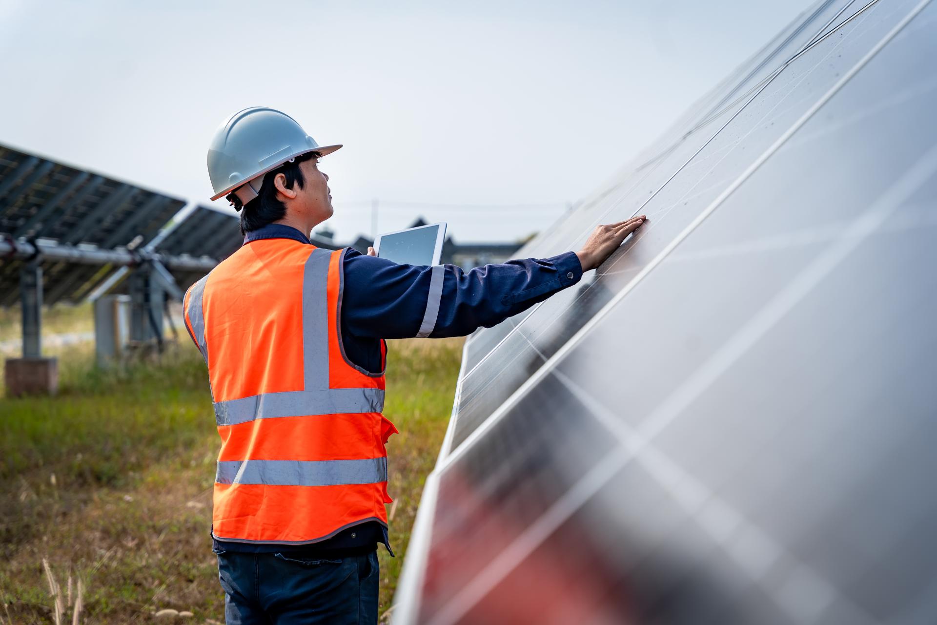 Solar worker evaluating a solar array