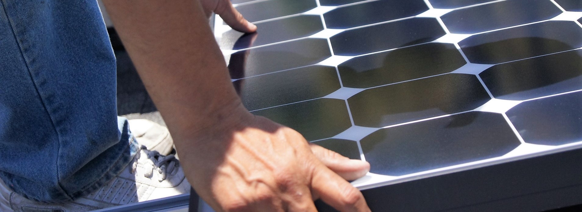 solar panel workers hand